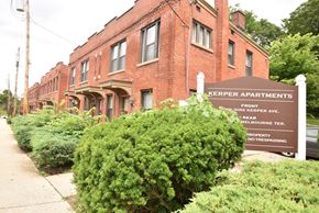 Cincinnati apartment for rent - a sign for kepler apartments in front of a brick building