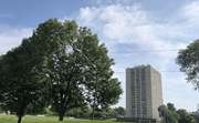 Chicago apartment for rent - a tall building in the middle of a park