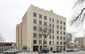 Chicago apartment for rent - a building with cars parked in front of it on a city street