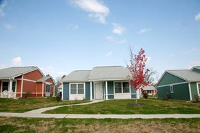 Cincinnati apartment for rent - a row of houses in a neighborhood on a sunny day