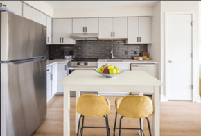 Washington apartment for rent - A kitchen with a table and chairs and a refrigerator.