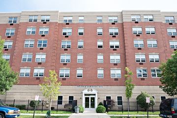 Chicago apartment for rent - a large brick building with a sidewalk in front of it