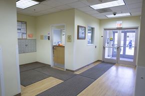 Chicago apartment for rent - a view of a hallway in a hospital with doors and a counter