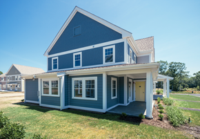 Sandwich apartment for rent - a blue house with a porch and a lawn