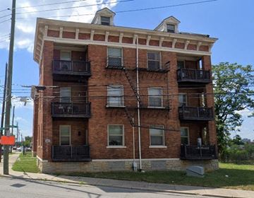 Cincinnati apartment for rent - a red brick apartment building on the side of a street