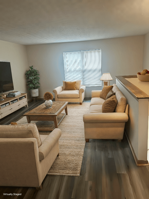 Blacklick apartment for rent - A living room with a couch, chair, and coffee table.