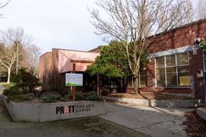 Seattle apartment for rent - The Pratt Fine Arts Center is a red brick building with a sign in front.