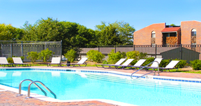 La Vista apartment for rent - Swimming pool with sundeck, pool-side lounge chairs, and park-like setting in La Vista, Nebraska