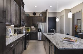 Golden Valley apartment for rent - Luxury apartments with spacious floor plan, granite countertops, stainless steel appliances, built-in wine rack, kitchen island, and porcelain tile floor at Xenia Apartments in Golden Valley, Minnesota