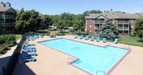 Lincoln apartment for rent - Apartments in Lincoln, Nebraska with two swimming pools, scenic views, lots of trees, poolside lounge chairs, and extra large sundeck