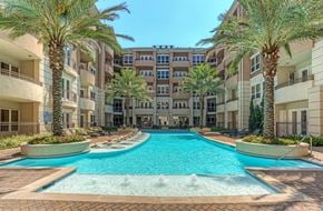 Houston apartment for rent - Luxury apartments with resort-style pool and palm trees, fountains, lap lane, and pool-side lounge chairs