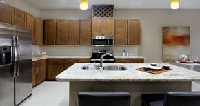 West Des Moines apartment for rent - Luxury apartments with granite countertops, stainless steel appliances, built-in wine rack, kitchen island, and porcelain tile floor at Bellemeade Apartments in west Des Moines