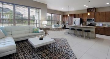 West Des Moines apartment for rent - a living room and kitchen with a couch and a table