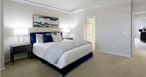 Houston apartment for rent - Huge bedroom, spacious bedroom with vaulted ceiling, ceiling fan, walk-in closet, and attached bathroom at Tuscany Row Townhomes in Houston.