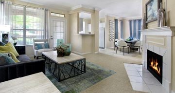 West Des Moines apartment for rent - a living room with a fireplace and a table