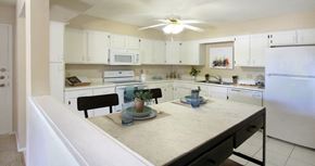 La Vista apartment for rent - Spacious kitchen with lots of cabinet space, lots of counter space, white kitchen cabinets, bright white kitchen, porcelain tile floor, huge kitchen at Alpine Village Apartments in La Vista, Nebraska