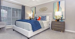 Dallas apartment for rent - Spacious bedroom with gray colored walls, large windows and walk-in closet, at The Dorchester Apartments in Dallas Texas