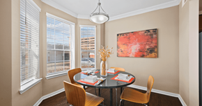 Houston apartment for rent - Spacious dining room with large bay windows and hardwood floors at Tuscany Park Apartments in Houston.