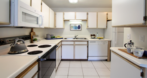 Lincoln apartment for rent - Spacious kitchen with extra cabinet space, extra counter space, tiled floors, bright white kitchen, at Tanglewood Apartments in Lincoln, Nebraska