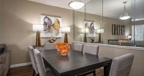 Houston apartment for rent - Dining area with mirror accent wall at Woodlake on the Bayou Apartments in Houston Texas