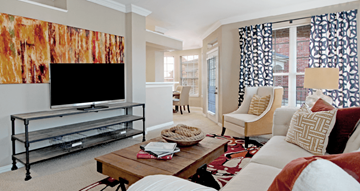 Omaha apartment for rent - a living room with a couch and a television