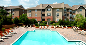 Omaha apartment for rent - Resort-style pool with large sundeck, poolside lounge chairs, lush landscaping, beautiful landscaping, park-like setting with lots of trees at Breckenridge Apartments in southwest Omaha, Nebraska