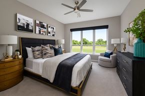 Chicago apartment for rent - a bedroom with a bed and a large window