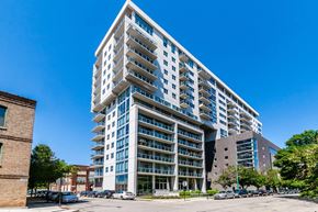 Chicago apartment for rent - an apartment building on a city street with a blue sky