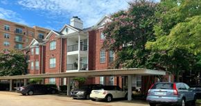 Houston apartment for rent - Luxury apartments in a gated community with covered car ports and red brick exteriors at Tuscany Oaks Apartments in Houston.