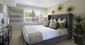 La Vista apartment for rent - Spacious bedroom with walk-in closet and gray wall color at The Inverness Apartments in La Vista, Nebraska