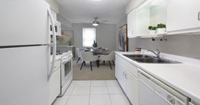 La Vista apartment for rent - Bright white kitchen with lots of cabinet space, porcelain tile floor, and spacious dining room at Inwood Apartments in La Vista, Nebraska