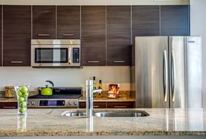 Chicago apartment for rent - a modern kitchen with stainless steel appliances and granite counter tops