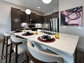 Lincoln apartment for rent - A modern kitchen with a dining table set for two.