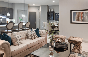 Houston apartment for rent - a living room with couches and chairs and a table