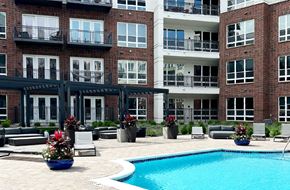 Golden Valley apartment for rent - Luxury resort-style swimming pool with poolside cabanas and lounge chairs at Xenia Apartments in Golden Valley Minnesota