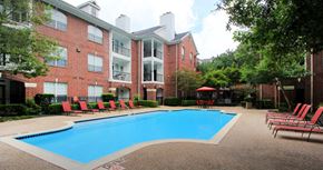 Houston apartment for rent - Luxury swimming pool with spacious sundeck, beautiful landscaping, and poolside lounge seating at Tuscany Oaks Apartments in Houston.