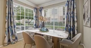Houston apartment for rent - Spacious dining room with huge windows and lots of natural light at Village on the Parkway Apartments in Houston Texas