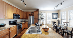 Houston apartment for rent - Luxury apartments in Houston with spacious kitchen and dining room with granite countertops, kitchen island, stainless steel appliances, oversized windows, lots of natural light, and hardwood floors.