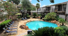 Houston apartment for rent - Gated apartment community with pool, spa, poolside lounge chairs, lush landscaping, beautiful landscaping, and neighborhood setting in Houston, Texas