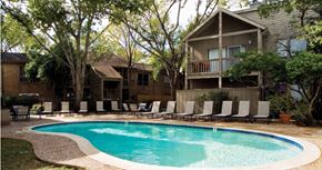 Houston apartment for rent - Gated apartments with 2 swimming pools, convenient bayou location, lush landscaping and scenic views at Woodlake Oaks Apartments in Houston.