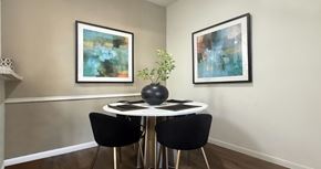 Houston apartment for rent - A dining room with a white table and chairs.