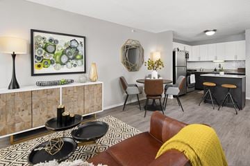 Chicago apartment for rent - a living room with a couch and a table and a kitchen