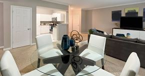 Omaha apartment for rent - Apartments in southwest Omaha with spacious layout, spacious living room, spacious dining room, granite countertops, white kitchen cabinets, and stainless-steel appliances at Breckenridge Apartments in southwest Omaha, Nebraska