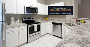 Omaha apartment for rent - Spacious kitchen with white cabinets, granite countertops, stainless steel appliances, and porcelain tile floors at Breckenridge Apartments in southwest Omaha, Nebraska