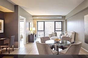 Chicago apartment for rent - a open dining room with table and lamp.