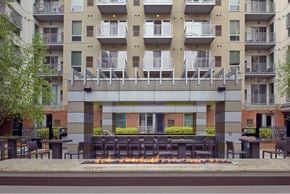 Minneapolis apartment for rent - A modern building with a fire pit in front.