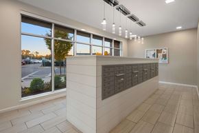 Wyandanch apartment for rent - A reception area with a large window overlooking a parking lot.