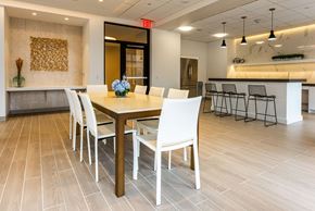 Wyandanch apartment for rent - A dining room with a table set for four.