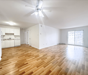 Moncton apartment for rent - A room with wooden flooring and a ceiling fan.