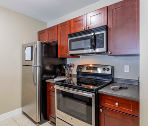 Fredericton apartment for rent - A kitchen with a refrigerator, oven, and microwave.